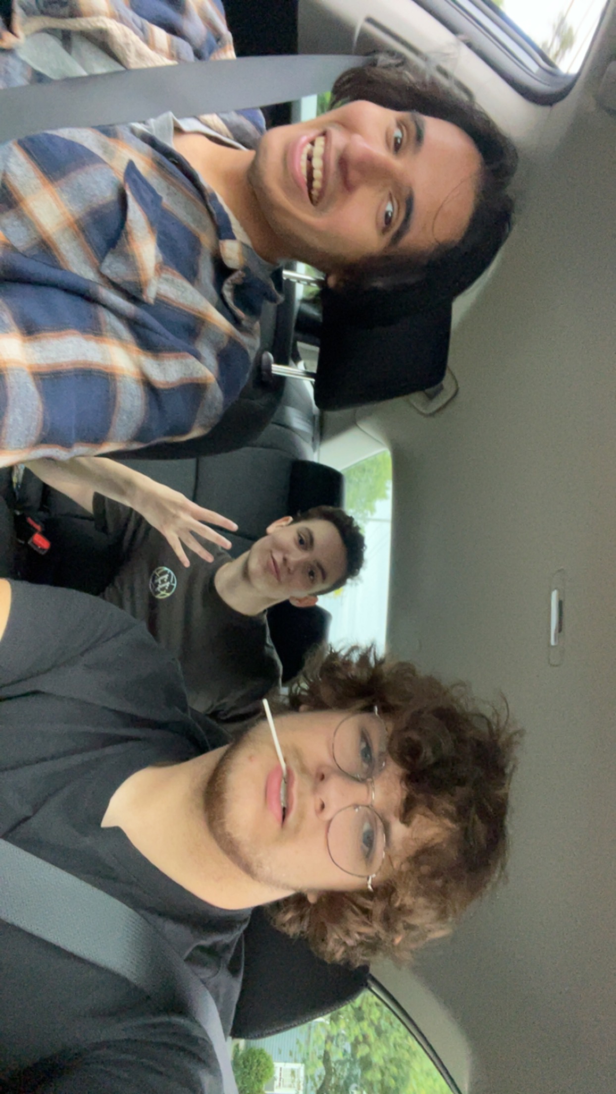 a picture of me in a car with two of my friends from home