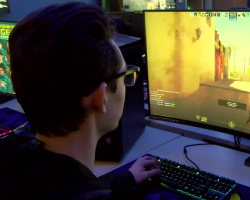 a reflection of me (Nathan Lodge) holding up a peace sign in front of a laptop with Visual Studio Code open